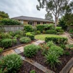 Winter garden in Sydney showing mulched garden beds, shrubs, and damp soil under cool overcast sky
